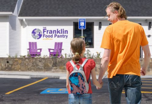Child and Parent Walking to Franklin Food Pantry